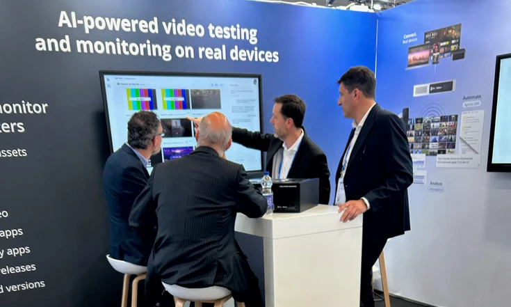 Visitors watching a live demo on the Witbe booth at ANGA COM 2026.