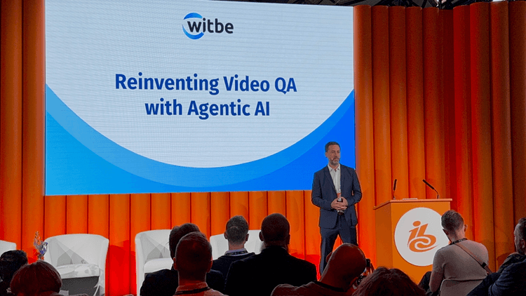 Witbe CEO presenting “Reinventing Video QA with Agentic AI” on stage at IBC 2025.