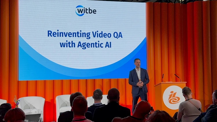 Witbe CEO presenting “Reinventing Video QA with Agentic AI” on stage at IBC 2025.