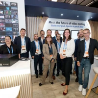 Witbe team at IBC 2025 booth, group photo in front of the stand with Agentic AI display.